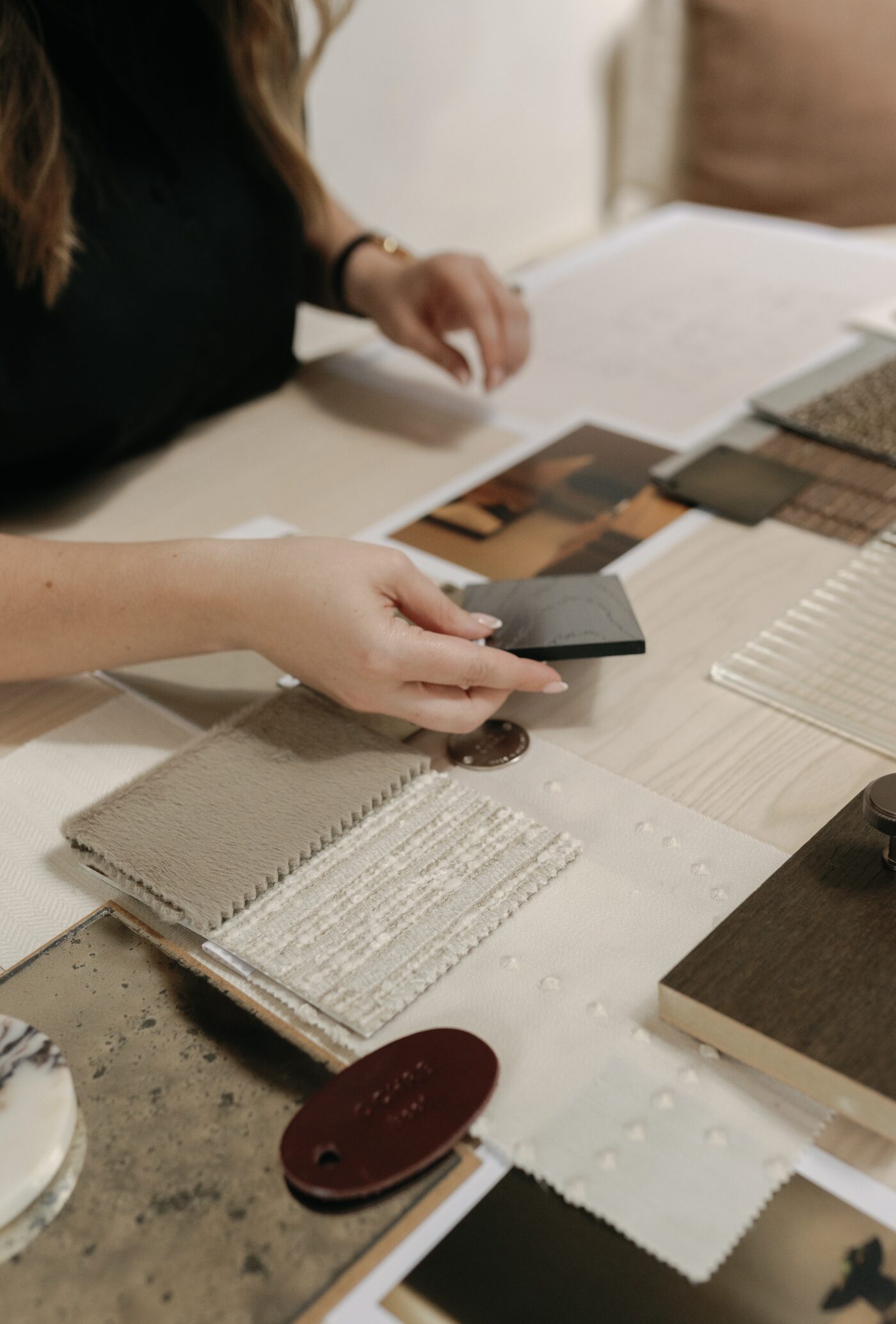 Selecting fabric and material samples in the studio
